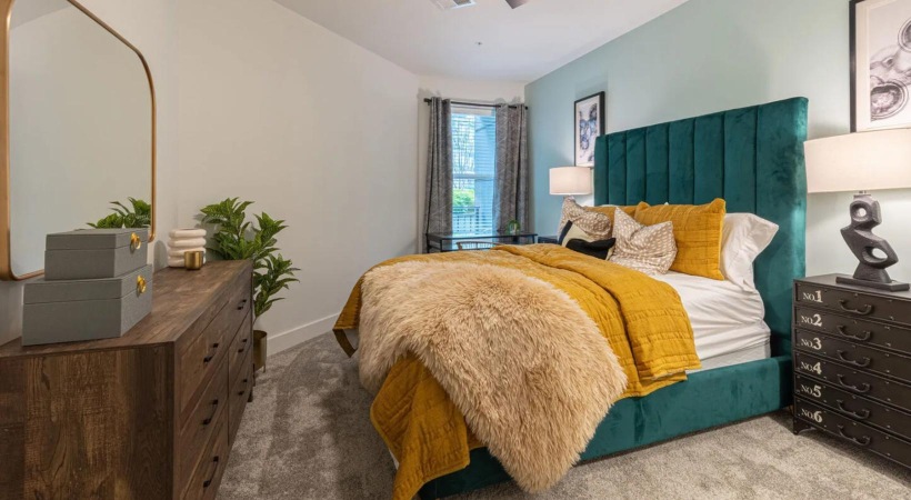 Beautiful bedrooms to fit every need a bedroom with a bed and a dresser