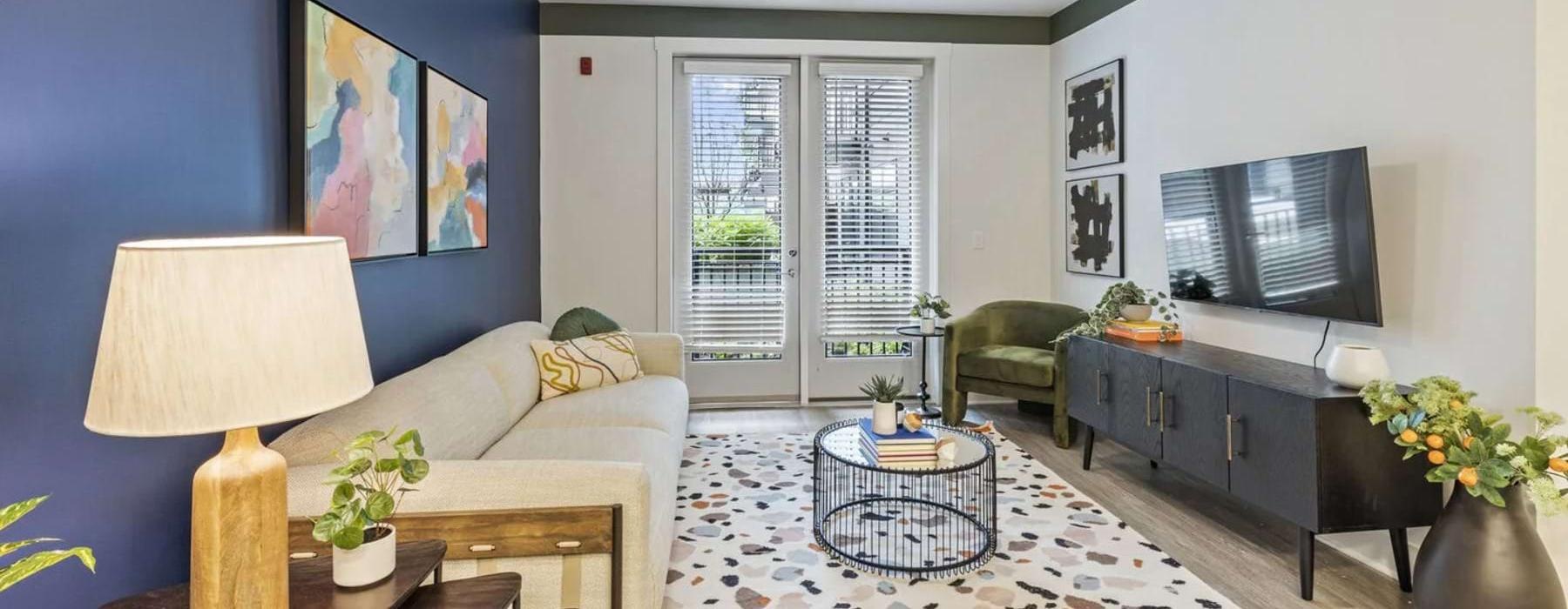 a living room with a tv and couches